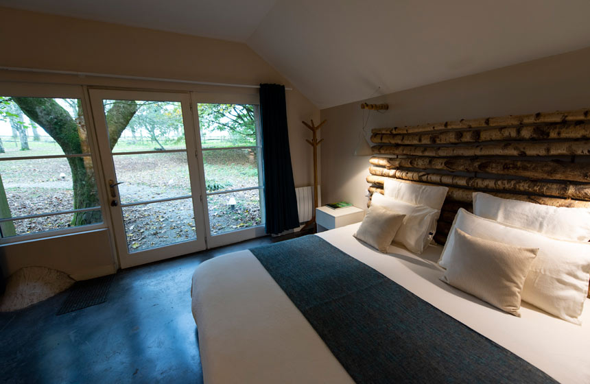 The suite's big garden doors give the room the blissful sense of being seamless with nature